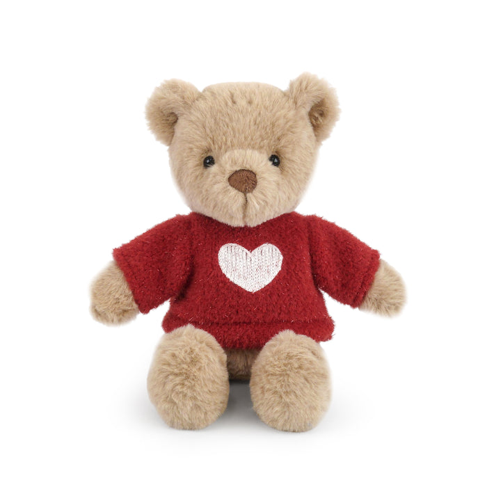 Plush teddy bear wearing a red sweater with a heart on a white background