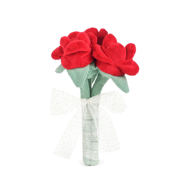 Red plush roses in a green and white striped vase on a white background
