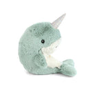 Plush toy narwhal on a white background