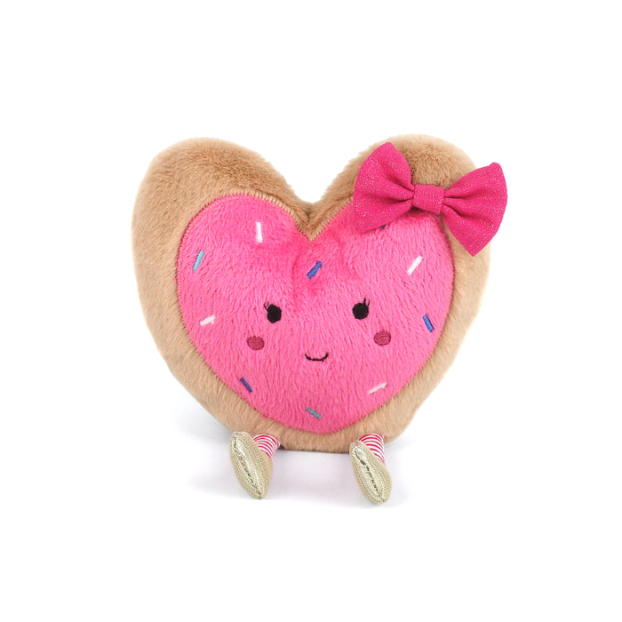 Heart-shaped pink donut plush toy with a bow on a white background