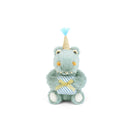 Plush toy bear with a unicorn horn and party hat on a white background