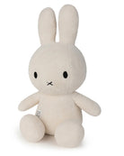 White plush bunny toy with a visible brand logo on a white background