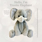 Gray plush elephant toy with white tusks sitting upright.