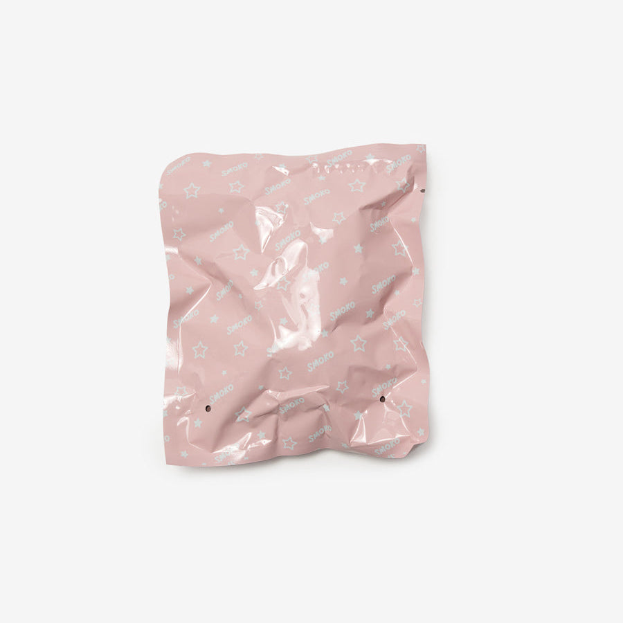 Pink crumpled paper bag on a white background