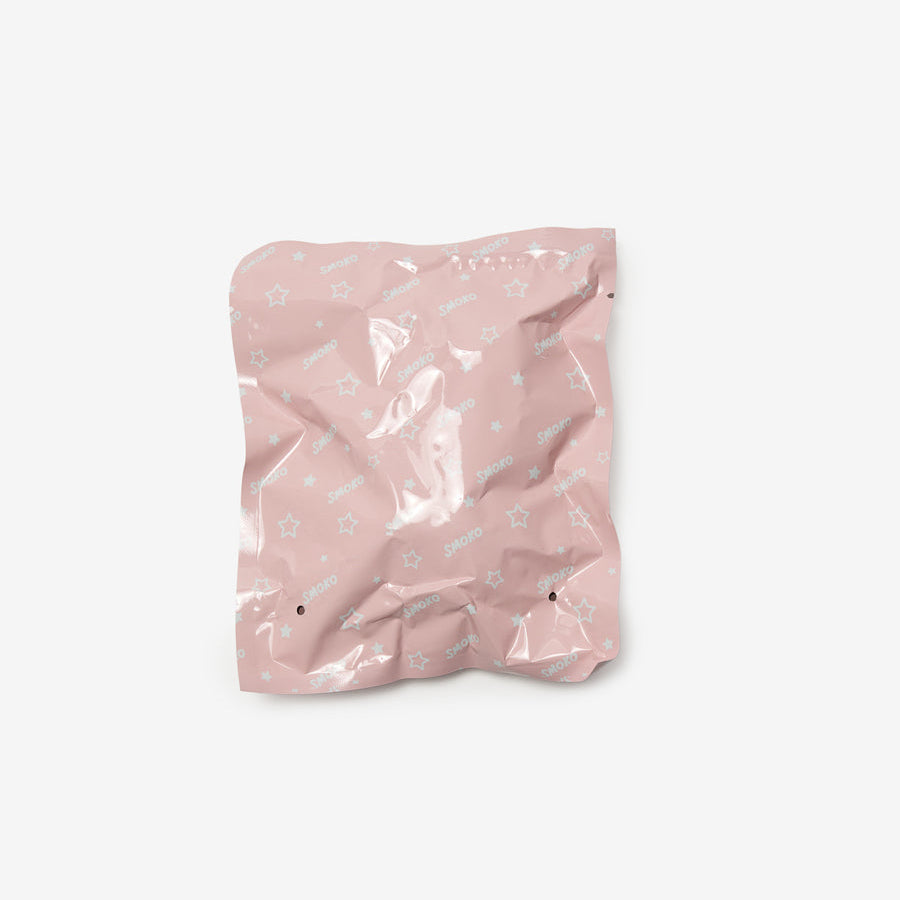 Pink crumpled paper bag on a white background