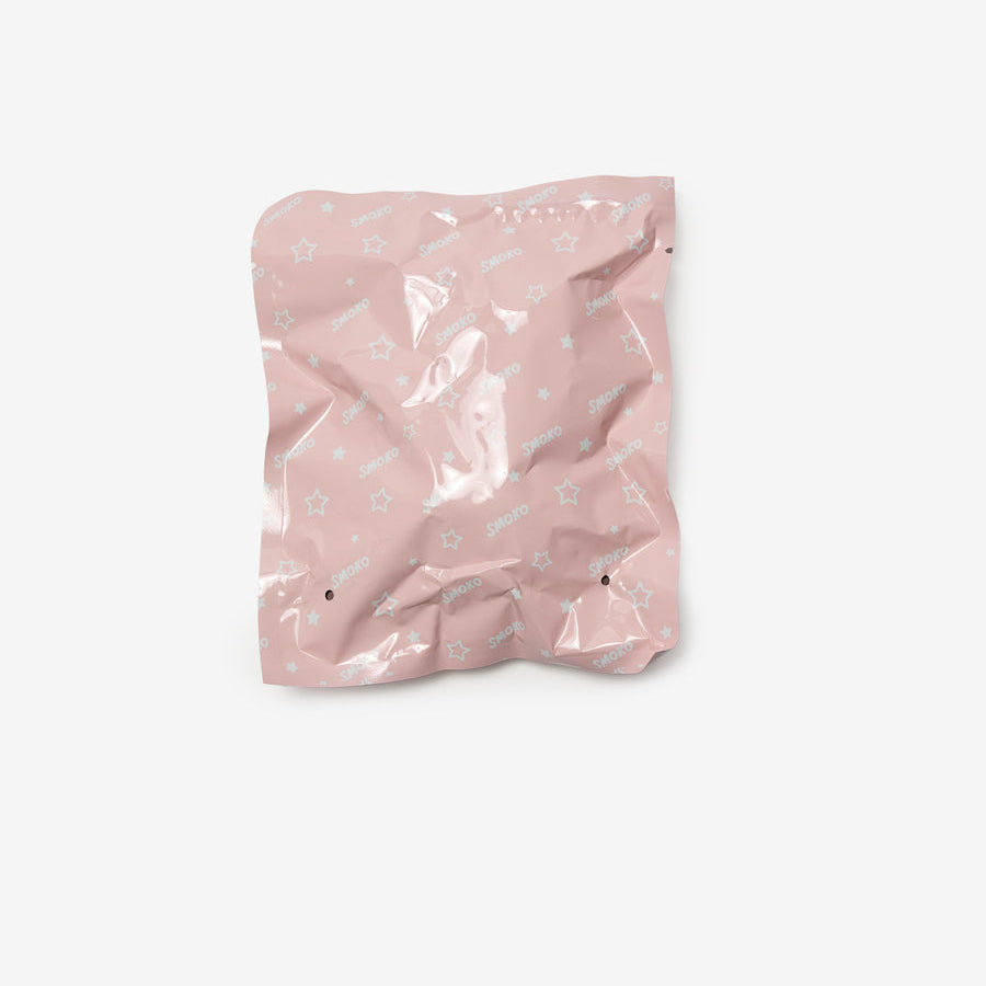 Pink crumpled paper bag on a white background