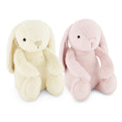 Two plush bunny toys side by side on a white background, one in cream and one in light pink.