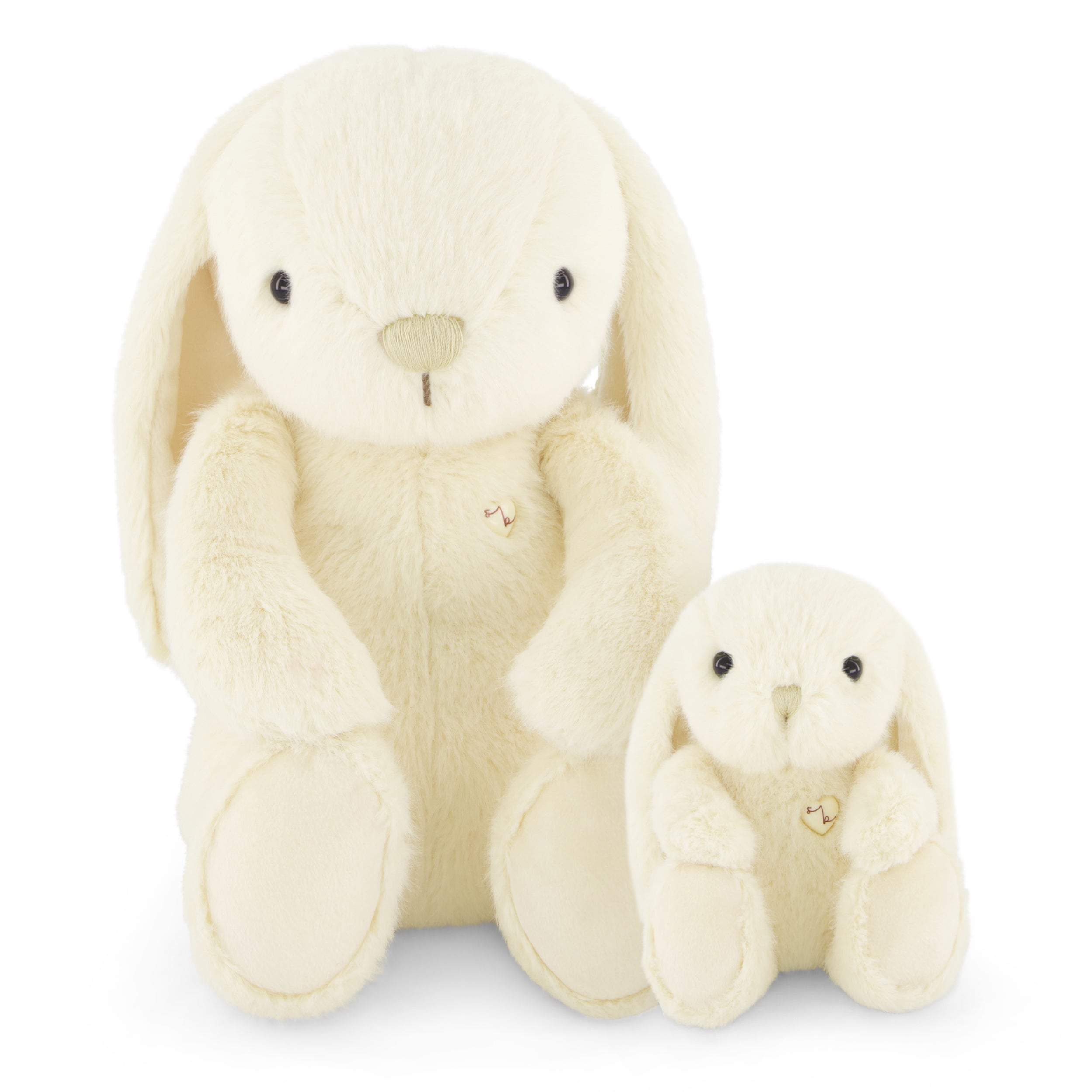 Two plush bunny toys sitting side by side.