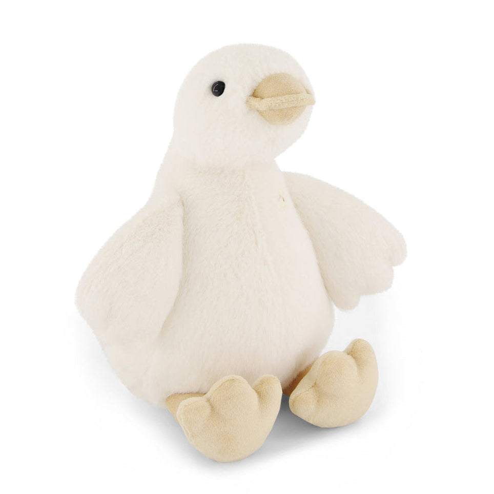 Off-white plush duck toy with tan beak and feet.
