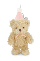Teddy bear keychain with pink hat on a white background