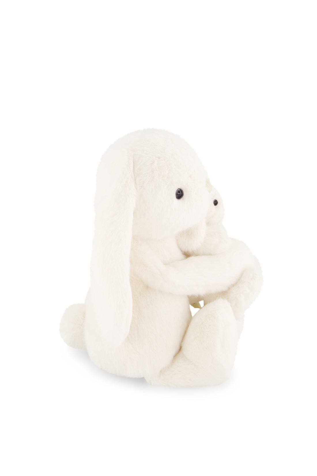 White plush toy sitting on a white background