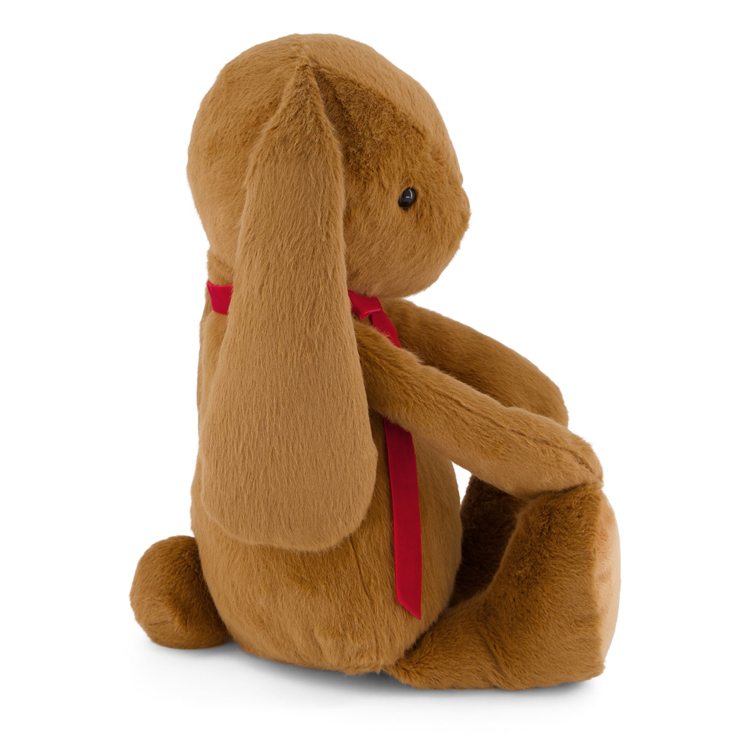 Brown plush bunny with a red bow tie on a white background