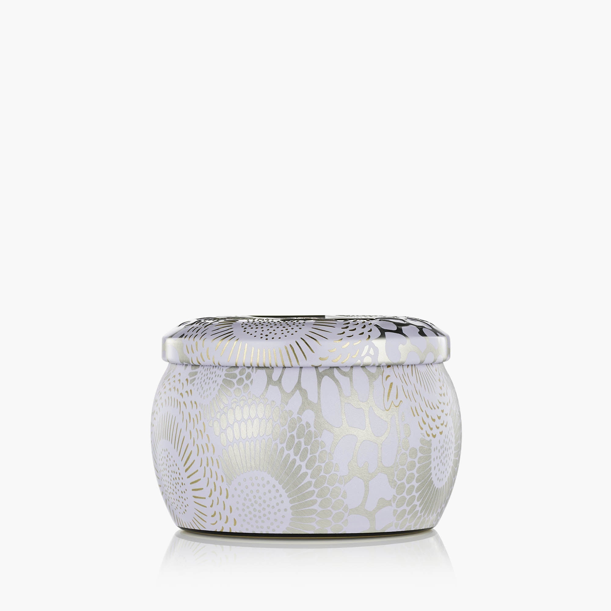 White ceramic jar with decorative patterns on a white background