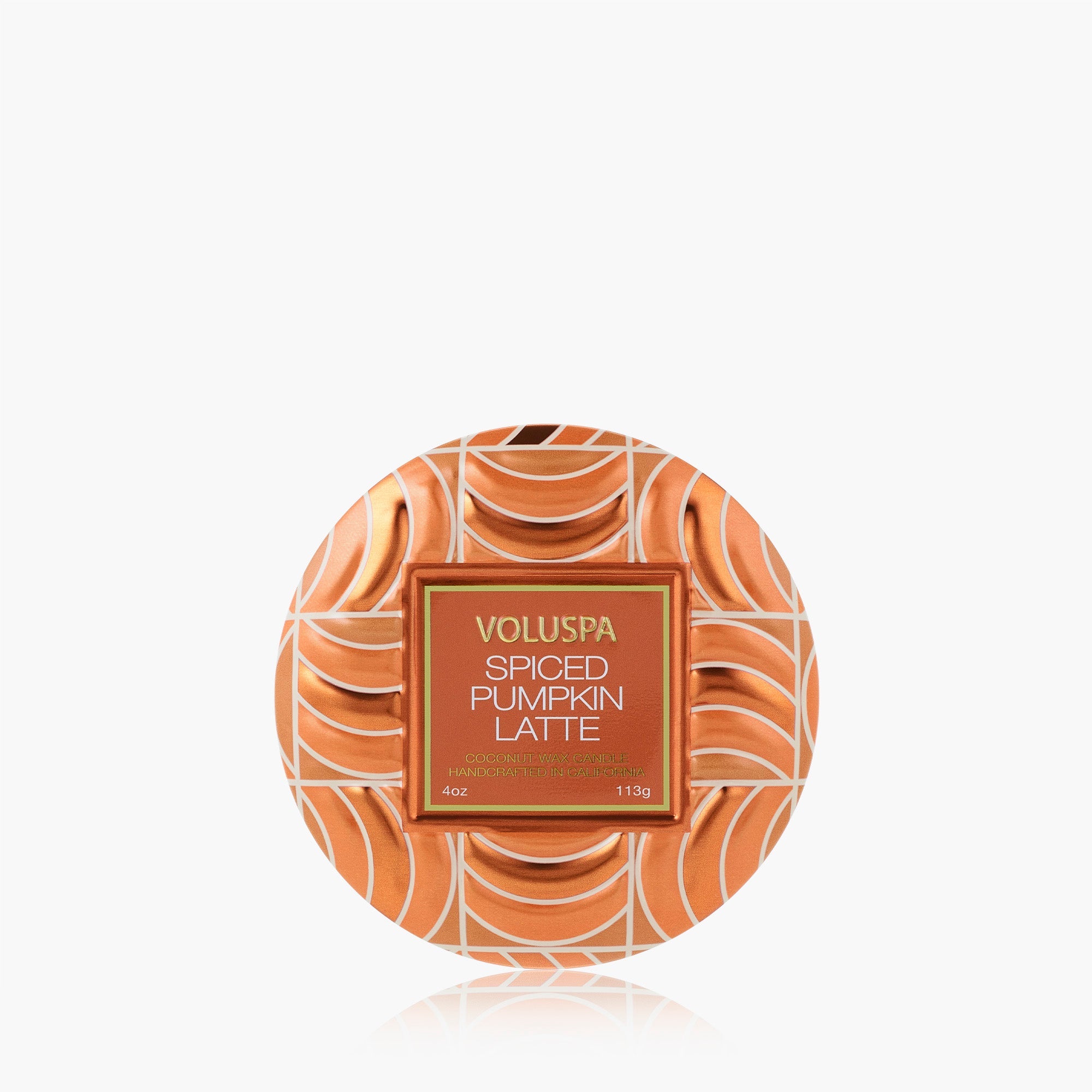 Voluspa Spiced Pumpkin Latte body butter in a round tin with a warm orange and white swirl pattern, centered on a light gray background.