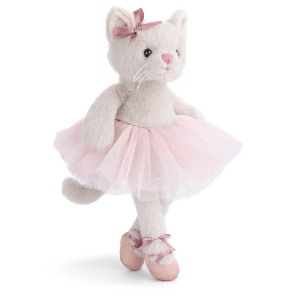 Plush cat toy in a pink tutu and ballet shoes on a white background