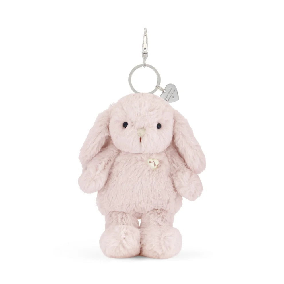 A fuzzy, light pink bunny plush toy attached to a metal keychain.