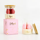 Jellycup floral collection candle set featuring a clear jar with red tulips and a bamboo lid, alongside a pink decorative box and a second clear jar with pink tulips and a bamboo lid, on a white background.