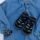 Denim shirt, toy car, car-patterned slipper socks.
