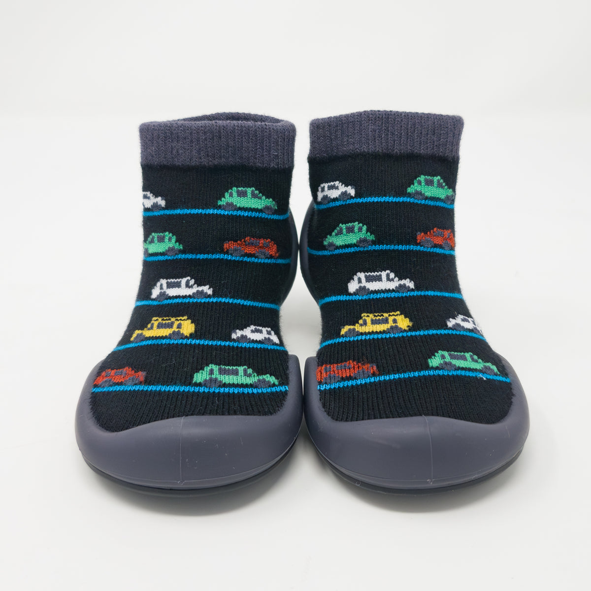 A pair of black socks with colorful car patterns and gray soles.