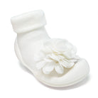 White baby sock-shoe with a flower accent.
