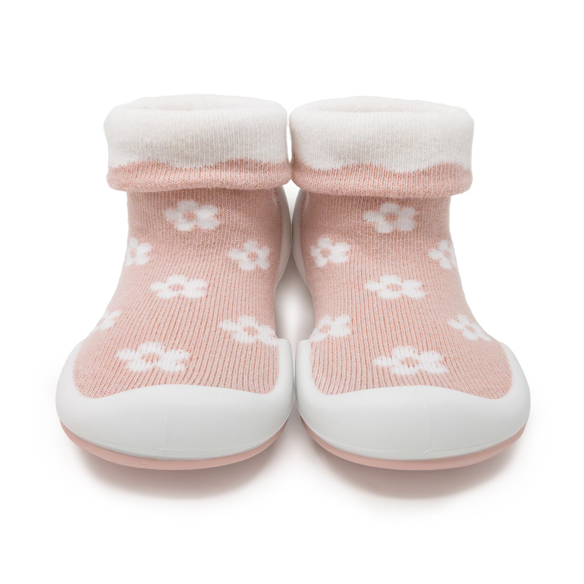 Pair of pink and white baby sock shoes.
