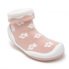 Pink sock shoe with white flowers.