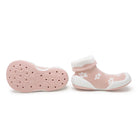 Pair of pink sock shoes with white floral pattern.