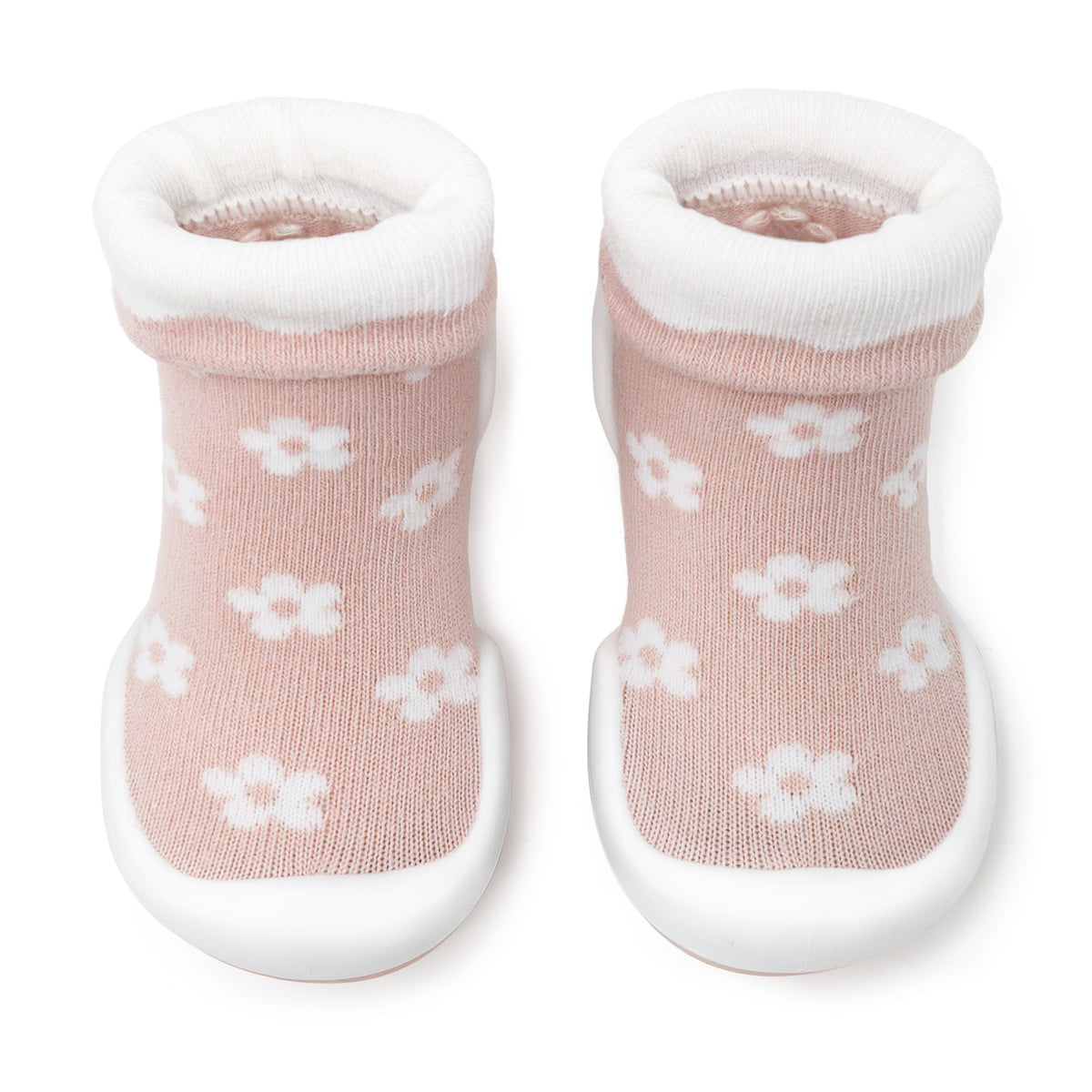 Pair of pink baby sock shoes with white flowers and soles.
