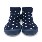 Navy socks with white polka dots and blue sole on a white background