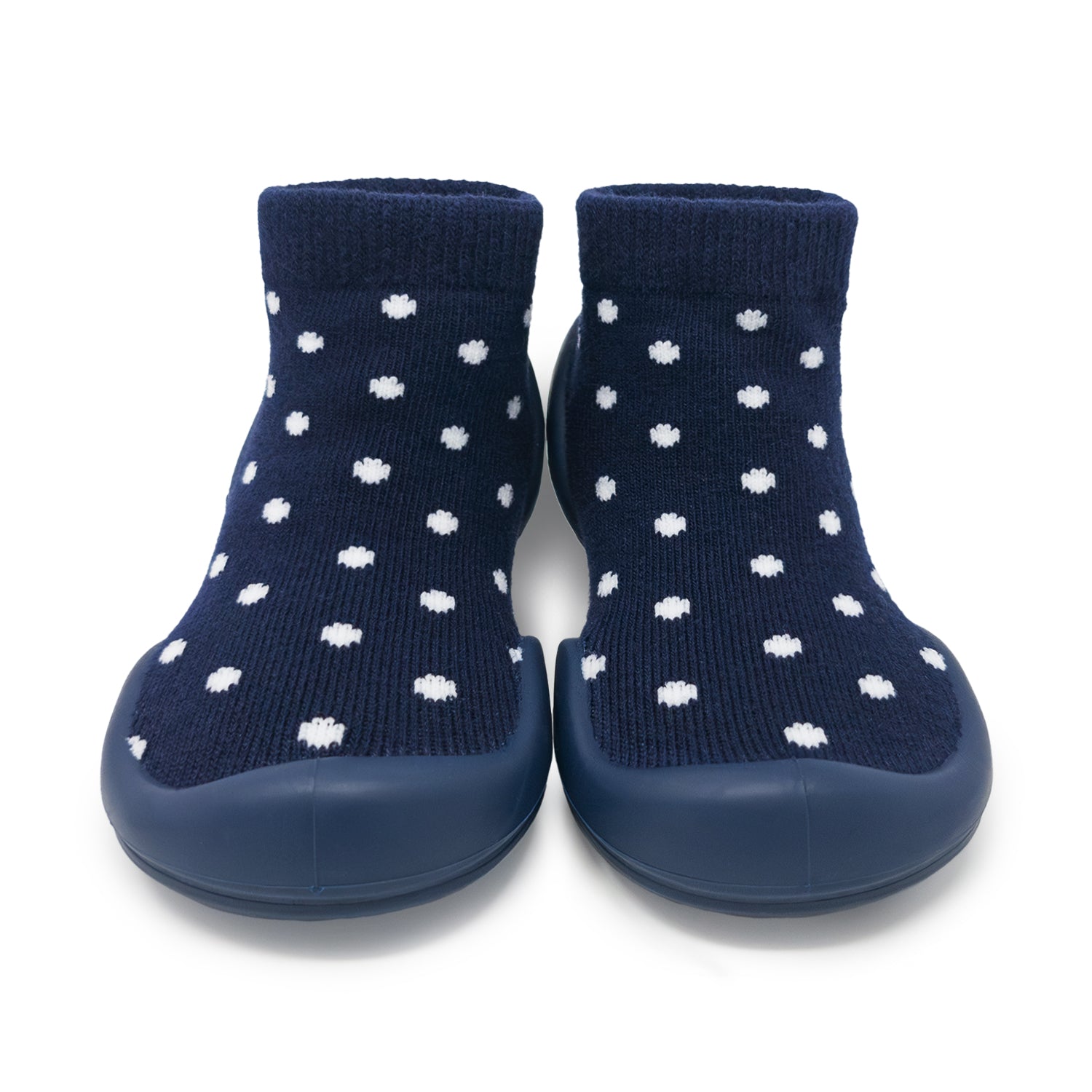 Navy socks with white polka dots and blue sole on a white background
