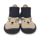 Pair of bear-themed socks with navy blue tops and beige feet on a white background