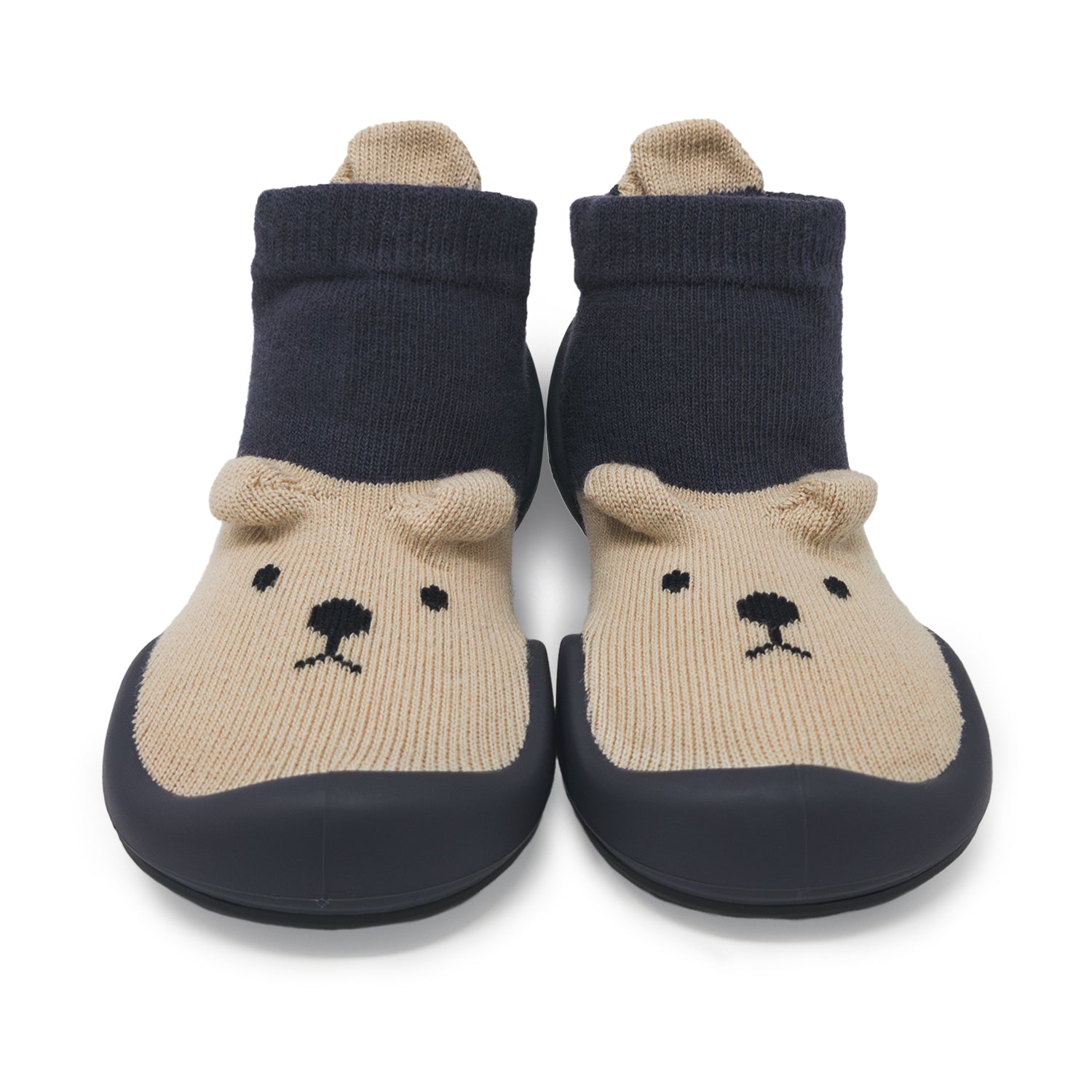 Pair of bear-themed socks with navy blue tops and beige feet on a white background