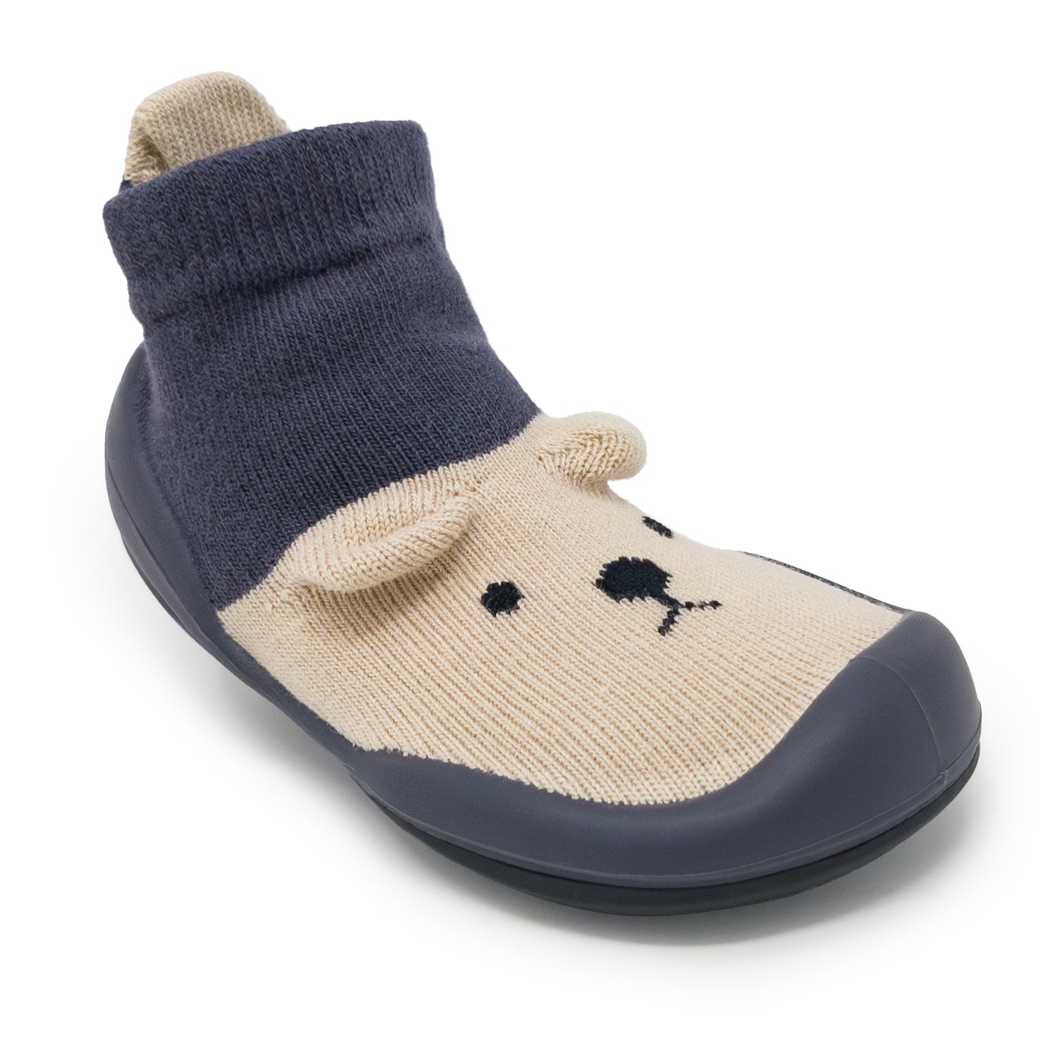 Children's slipper with navy blue top and beige bottom on a white background