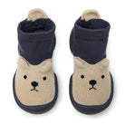 Pair of baby booties with bear face design on a white background