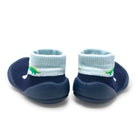 Two navy blue baby shoes with light blue ribbed socks.