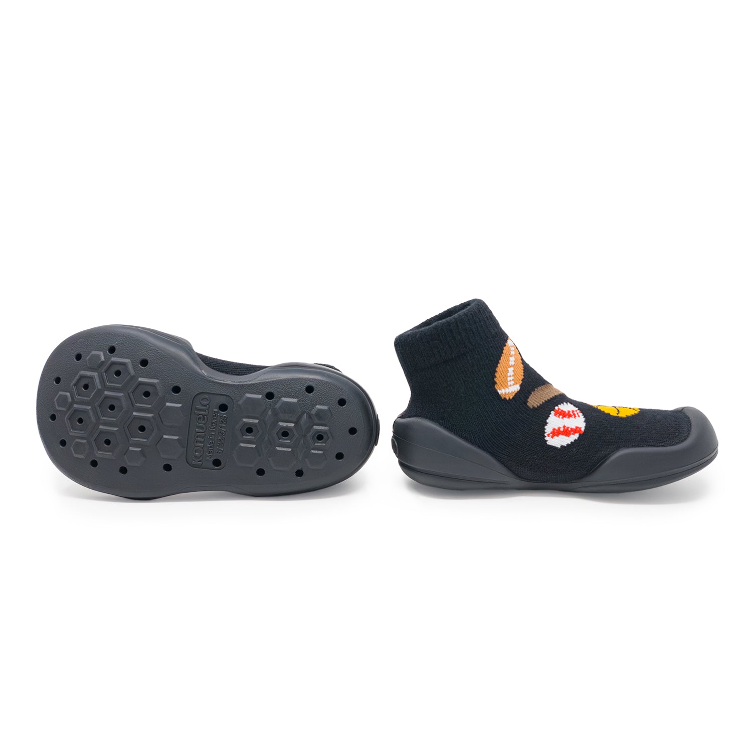 Black children's shoes with a sole pattern on a white background