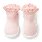 Pair of pink Komuello baby sock shoes with lace trim on a white background