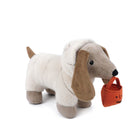 Stuffed dachshund in a sheep costume carrying a pumpkin candy bucket.