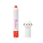 Cosmetic product: white crayon and a cartoon-sheep-adorned cap.