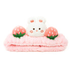 Pink headband with white bunny and strawberry details.