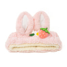 Pink furry bunny ear headband with strawberry and flower embellishments.