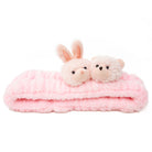 Pink plush headband with bunny and bear.