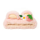 Pink plush headband with ears, a white flower, and a pink strawberry.