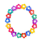 Colorful flower-shaped gel beads arranged in a circular pattern on a white background