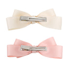 Set of two large double satin ribbon bow clips, cream and pink, with silver alligator clips on the back.