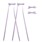 Lavender ribbon bow clip set featuring two bows with long trailing ribbons and two smaller bow clips.