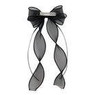 Black organza double ribbon clip with a delicate bow and two long, wavy sheer ribbons attached.