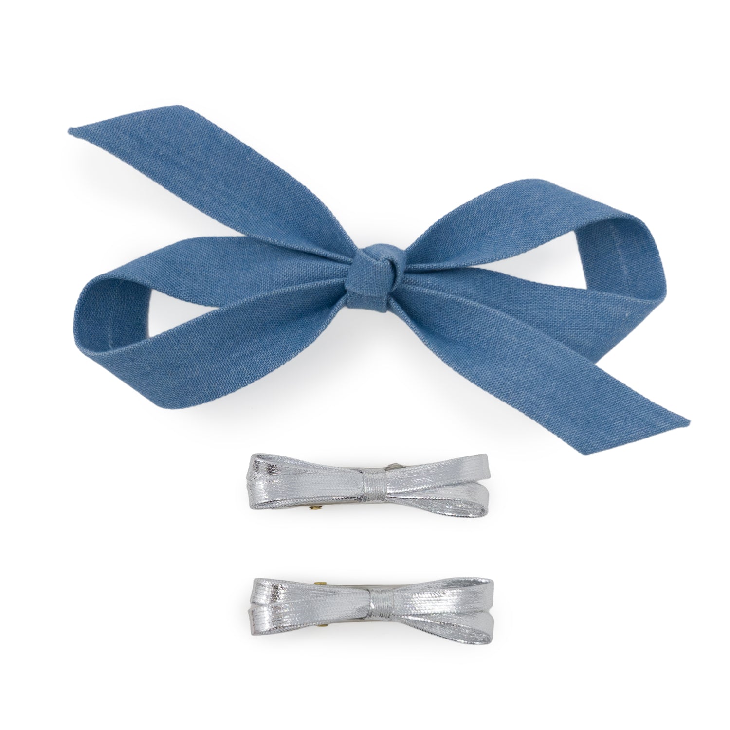 Three-piece bow clip set featuring one large light denim bow and two smaller silver metallic bows.