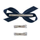 Set of three hair clips: one large dark blue denim bow with subtle light stripes, and two small silver bow clips, all with alligator clips.