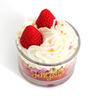 Small dessert in a glass container with whipped cream and strawberries on a white background